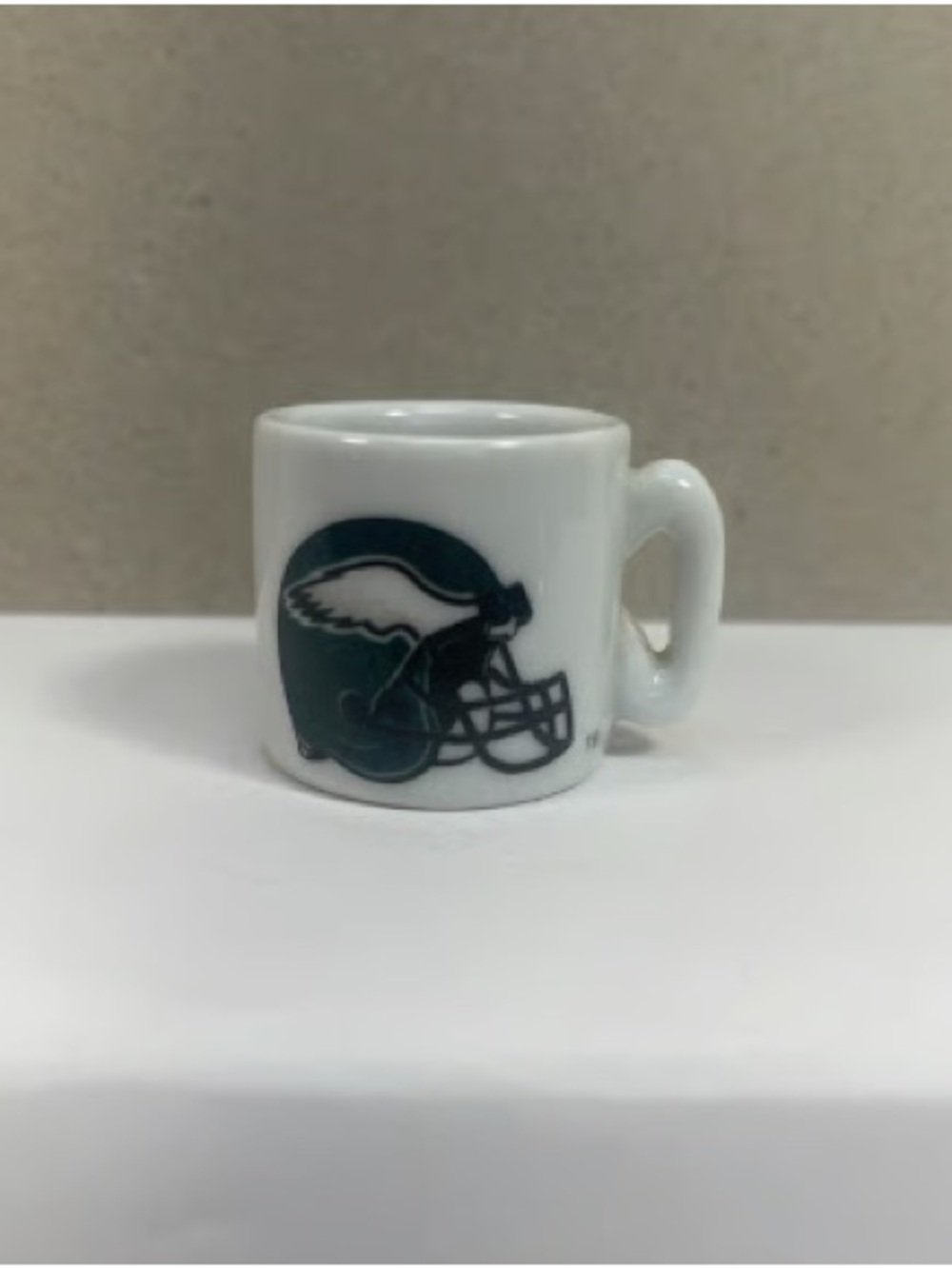 White Ceramic Coffee Mug with Green Helmet Logo